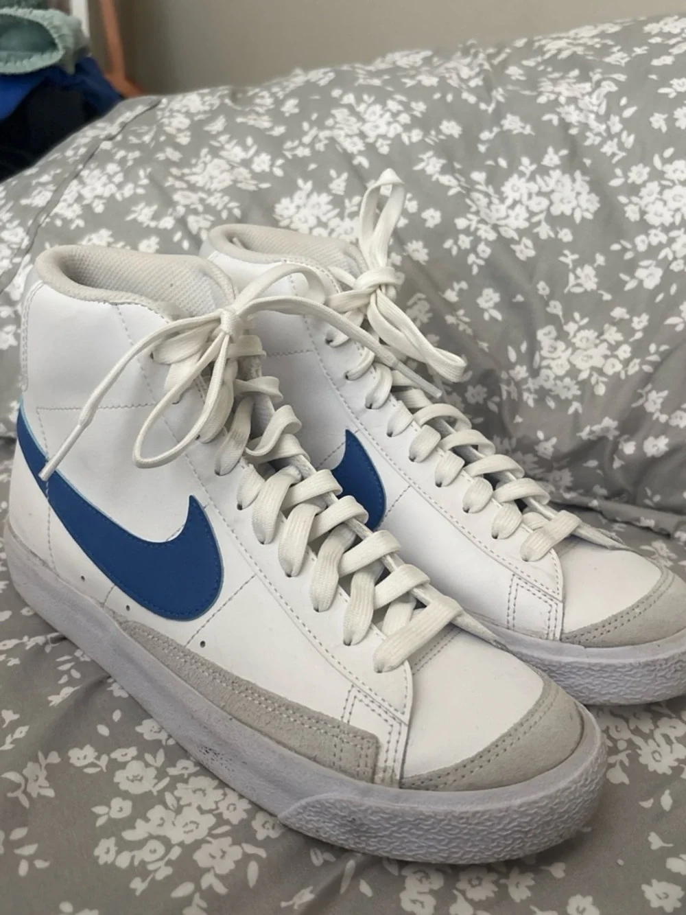 Nike White High-Top Sneakers with Blue Swoosh
